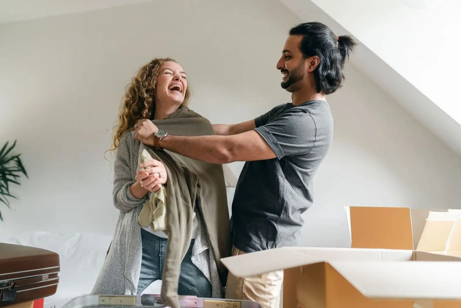 A couple unpacking boxes in their new home